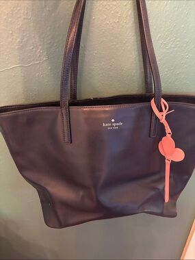 kate spade navy leather tote with pink charm
